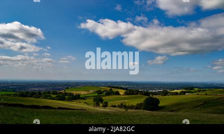 Beautiful vista looking over the rolling hills seen from the summit of the Teggs Nose Walk in the Peak District near Macclesfield, United Kingdom. Stock Photo