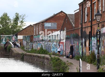 Leicester, Leicestershire, UK. 28th May 2022.  An artist spray paints a  mural during the Bring the Paint event. The award winning International Street Art Festival attracts artists from all over the world. Credit Darren Staples/Alamy Live News. Stock Photo