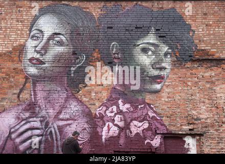 Leicester, Leicestershire, UK. 28th May 2022.  An artist spray paints a  mural during the Bring the Paint event. The award winning International Street Art Festival attracts artists from all over the world. Credit Darren Staples/Alamy Live News. Stock Photo