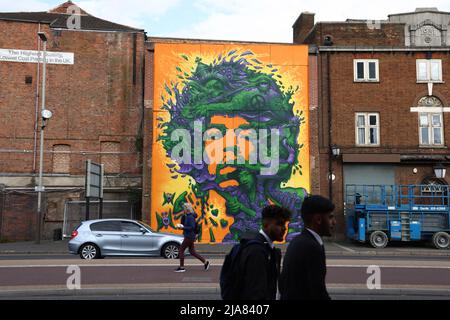 Leicester, Leicestershire, UK. 28th May 2022.  People walk past a spray painted mural during the Bring the Paint event. The award winning International Street Art Festival attracts artists from all over the world. Credit Darren Staples/Alamy Live News. Stock Photo