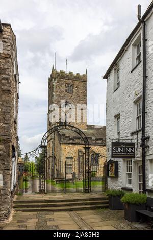 St Mary's parish church viewed along Church Street in the market town of Kirkby Lonsdale, Cumbria, England, Uk Stock Photo