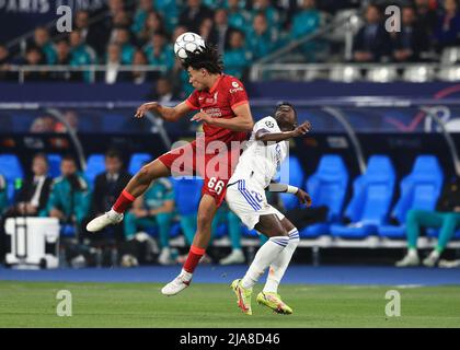 Paris, France. 28th May 2022; Stade de France stadium, Saint-Denis, Paris, France. Champions League football final between Liverpool FC and Real Madrid; Trent Alexander-Arnold of Liverpool heads the ball over Vinicius Junior of Real Madrid Credit: Action Plus Sports Images/Alamy Live News Stock Photo