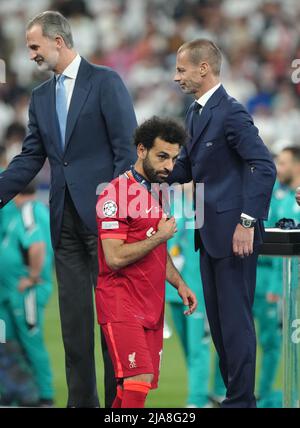 Liverpool's Mohamed Salah looks dejected after receiving his runner up medal following the UEFA Champions League Final at the Stade de France, Paris. Picture date: Saturday May 28, 2022. Stock Photo