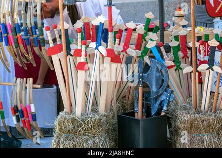 Wood toys, arches and swords made in wood. Traditional markets with ancient toys made by wood. Stock Photo
