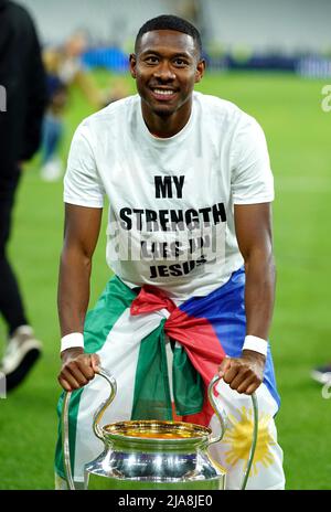 Real Madrid's David Alaba celebrates with the trophy after victory against Liverpool following the UEFA Champions League Final at the Stade de France, Paris. Picture date: Saturday May 28, 2022. Stock Photo