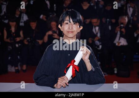 Director Hayakawa Chie poses with the Special Mention Award for a first film for 'Plan 75' during the winner photocall during the 75th annual Cannes film festival at Palais des Festivals on May 28, 2022 in Cannes, France. Photo by David Boyer/ABACAPRESS.COM Stock Photo