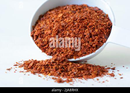 Aleppo Peppers Spilled from a Teaspoon Stock Photo