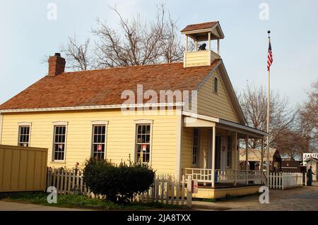 A one room schoolhouse sits in Old Sacramento, California and is now a museum to demonstrate education in the frontier era of the west Stock Photo