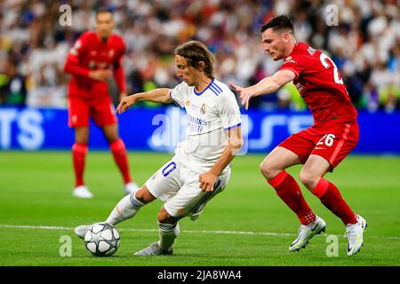 Liverpool's Andrew Robertson heads the ball during the Champions League  final soccer match between Liverpool and Real Madrid at the Stade de France  in Saint Denis near Paris, Saturday, May 28, 2022. (