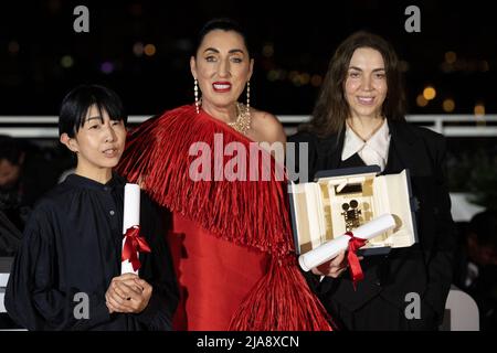 President of the Camera d'or jury, Rossy De Palma (C) poses with Director Chie Hayakawa who won the Special Mention for a first film winner for Plan 75 and Director Gina Gammell who won the Caméra d’or Award for a first film for War Pony during the 75th annual Cannes film festival at Palais des Festivals on May 28, 2022 in Cannes, France. Photo by David Niviere/ABACAPRESS.COM Stock Photo
