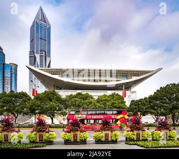 2 December 2018: Shanghai, China - The Shanghai Urban Planning Exhibition Center from People's Square, with a sightseeing bus in front. Stock Photo