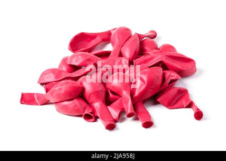 Red baby not inflated rubber balloons isolated on white Stock Photo