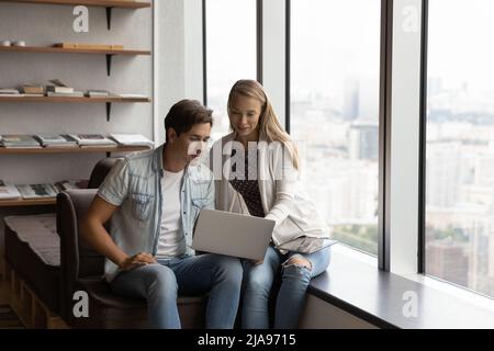 Two young business coworkers meeting in office lounge area Stock Photo