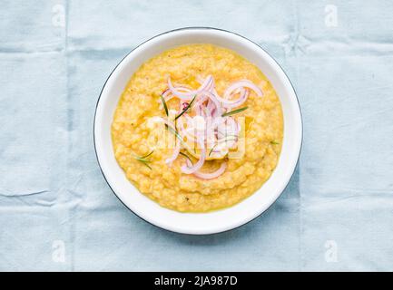 Yellow split peas dip with olive oil and green onions. Fava greek food. Stock Photo