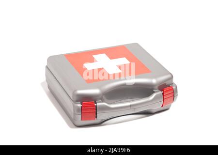 First aid kit with cross emblem isolated on a white background Stock Photo