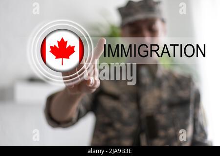 flag of canada and inscription immigration Stock Photo