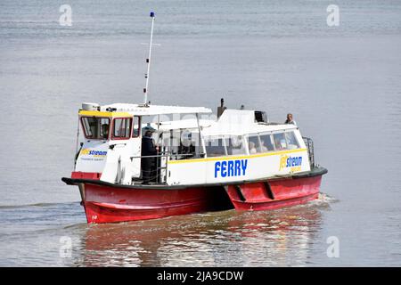 Passenger ferry boat 'Jet Stream' reversing from landing stage at Gravesend Kent crossing calm smooth River Thames for Tilbury in Essex England UK Stock Photo