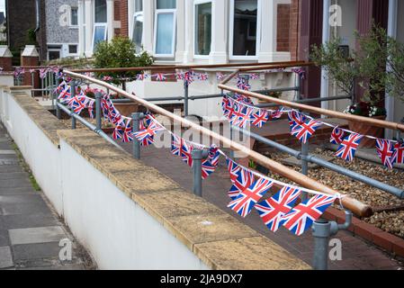 The British Union Jack flag decorating an English home as preparation for the Platinum Jubilee of Queen Elizabeth 2. Stock Photo