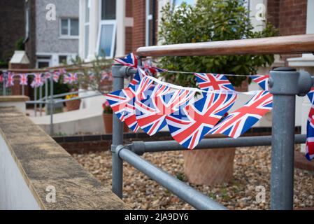 The British Union Jack flag decorating an English home as preparation for the Platinum Jubilee of Queen Elizabeth 2. Stock Photo