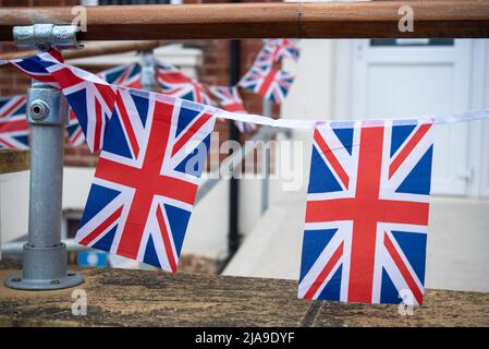 The British Union Jack flag decorating an English home as preparation for the Platinum Jubilee of Queen Elizabeth 2. Stock Photo