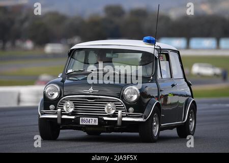 Winton, Australia. 29 May, 2022.  A Morris Cooper S used by the Queensland Police Force tours the Winton Race Circuit for the historic vehicle parade laps at Historic Winton, Australia's largest and most popular all-historic motor race meeting. Credit: Karl Phillipson/Optikal/Alamy Live News Stock Photo