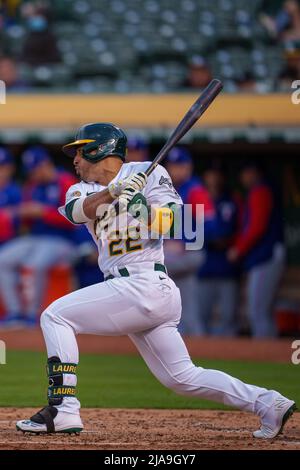 Oakland, USA. 26th May, 2022. Texas Rangers first baseman Nathaniel Lowe  (30) swings at a pitch during the fourth inning against the Oakland  Athletics in Oakland, CA Thursday May 26, 2022. (Image