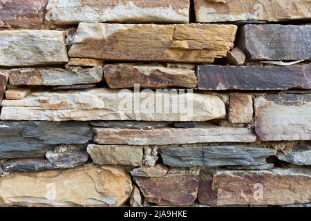 Rectangular stone wall in ocher tones Stock Photo