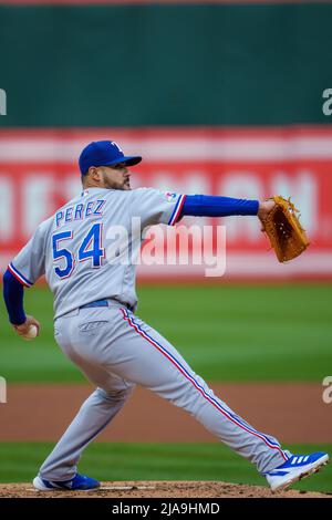 Oakland, USA. 26th May, 2022. Texas Rangers starting pitcher Martin Perez  (54) delivers a pitch during the first inning against the Oakland Athletics  in Oakland, CA Thursday May 26, 2022. (Image of