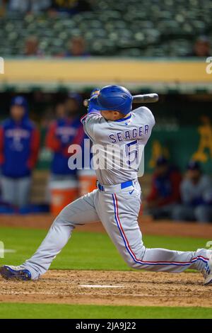 Oakland, USA. 26th May, 2022. Texas Rangers shortstop Corey Seager (5)  swings at a pitch during the fifth inning against the Oakland Athletics in  Oakland, CA Thursday May 26, 2022. (Image of Sport/Neville Guard) Photo via  Credit: Newscom/Alamy Live