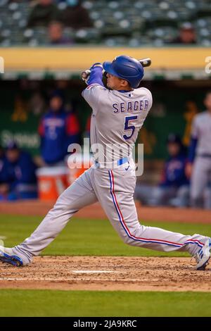 Texas Rangers shortstop Corey Seager throws to first after fielding a ...