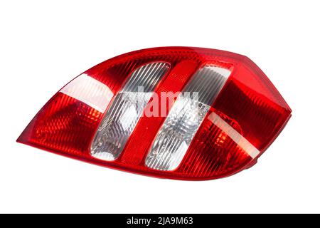 A taillight of a stop signal for a German auto - optical equipment of white and red color on a white isolated background. A spare part for repair and Stock Photo