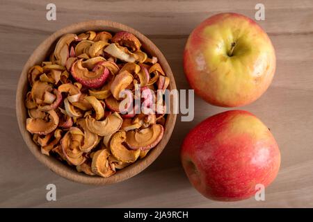 Dried apple slices and fresh apples Stock Photo