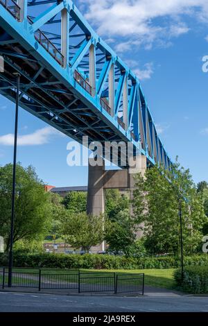 Queen Elizabeth II Metro bridge, a steel through-truss bridge crossing the River Tyne, Newcastle upon Tyne, UK as viewed from below. Stock Photo