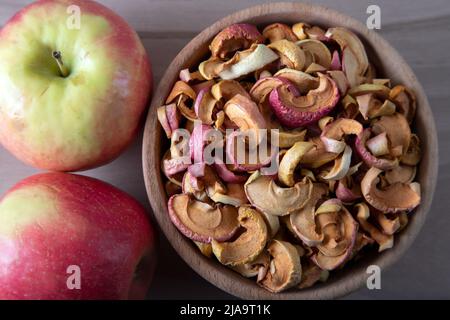 Dried apple slices and fresh apples Stock Photo
