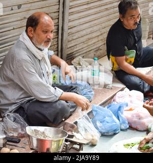 Old Delhi, India – April 15, 2022 - Portrait of shopkeepers or street vendors in Chandni Chowk market of Delhi, Old Delhi Street Photography Stock Photo