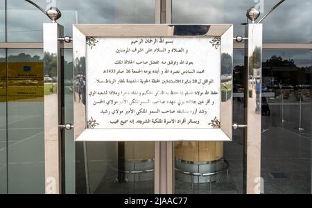 Dedication and praise of King of Morocco in Arabic on the poster sign in front of Rabat Sale Airport, Morocco Stock Photo