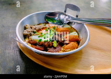 fried egg with tomato bacon in pan breakfast morning business food still life Stock Photo