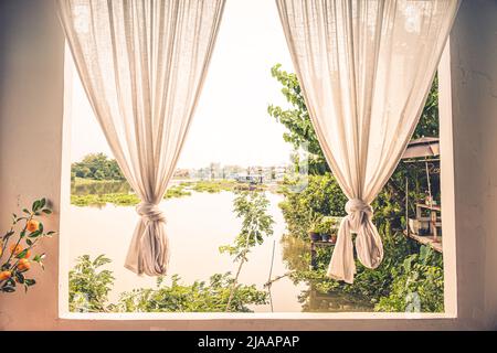 white linen curtain with window view green from river tree landscape Stock Photo