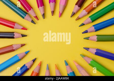 a few colored pencils on a yellow-blue background Develop creativity Get creative Stock Photo