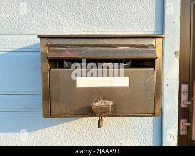 An old stainless steel mailbox Stock Photo