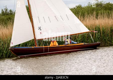 Horning, Norfolk, UK – May 28 2022. Traditional wooden sailing boat competing in the 2022 Three Rivers race, an annual boat race on the Norfolk Broads Stock Photo