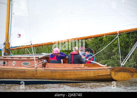 Horning, Norfolk, UK – May 28 2022. Morning Calm, a traditional river cruiser sailing on the River Bure leg of the 2022 Three Rivers Race Stock Photo