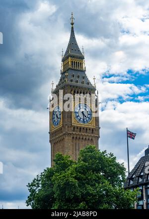 Big Ben Elizabeth Tower post refurbishment with Union Jack in foreground Stock Photo