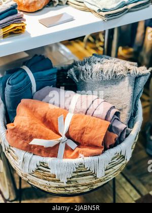 Natural linen textile products selling during local market. Sustainable lifestyle and conscious consumption concept Stock Photo