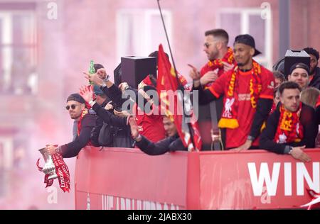 Liverpool's Jordan Henderson holds the Emirates FA Cup trophy on an open-top bus during the trophy parade in Liverpool. Picture date: Sunday May 29, 2022. Stock Photo