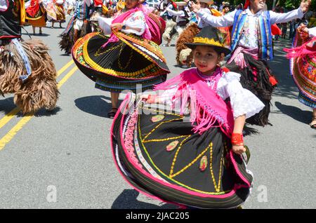 Girls are seen dancing with traditional Ecuadorian outfits during the Ecuadorian Independence Day Parade in New York City on May 29, 2022. Stock Photo