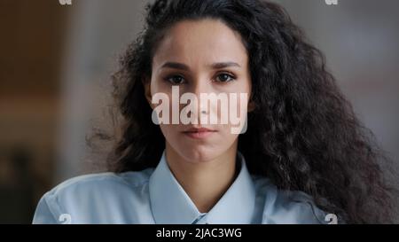 Portrait female upset face arab girl attractive hispanic woman with curly hair natural makeup sad model student serious offended frustrated facial Stock Photo