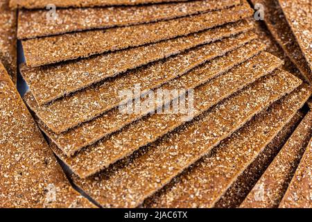 Crispy thin rye bread stack for eating as a food background. Stock Photo