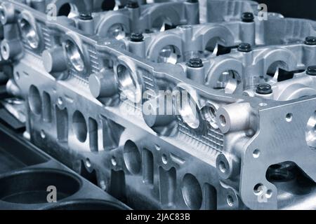 open block of four cylinder petrol engine. Close-up, industrial metalworking concept Stock Photo