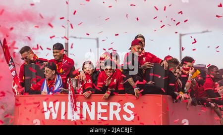 Players and staff of Liverpool Football Club celebrate on an open top bus through the streets of Liverpool in May 2022 having won the Carabao Cup and Stock Photo
